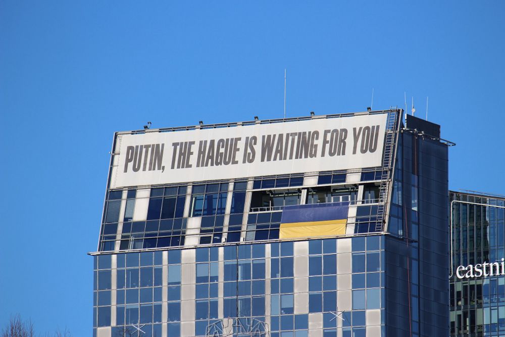 Putin, the Hague is waiting for you banner. 