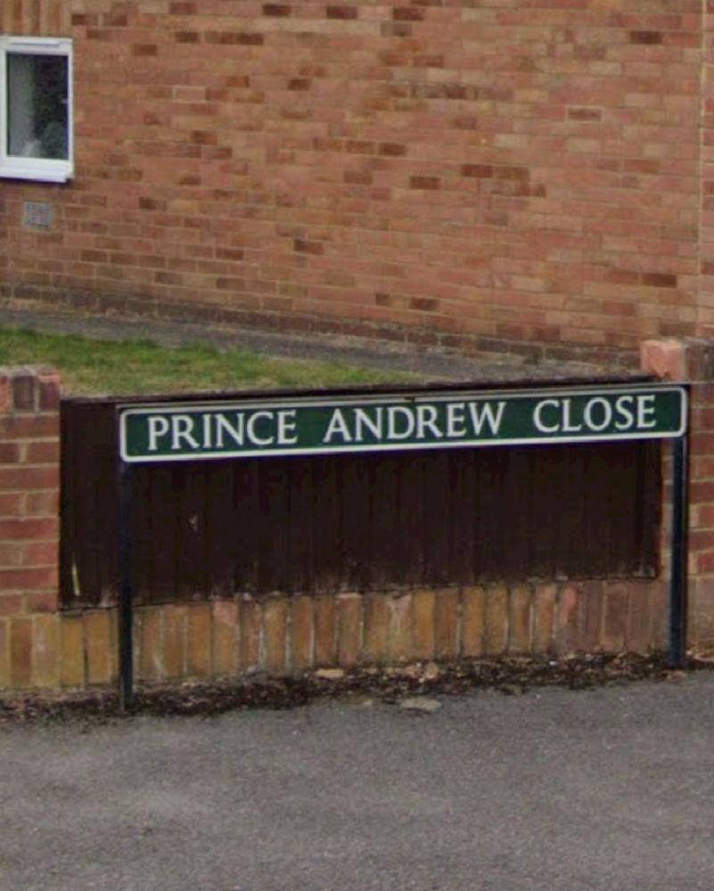 Road name sign: “Prince Andrew Close”.