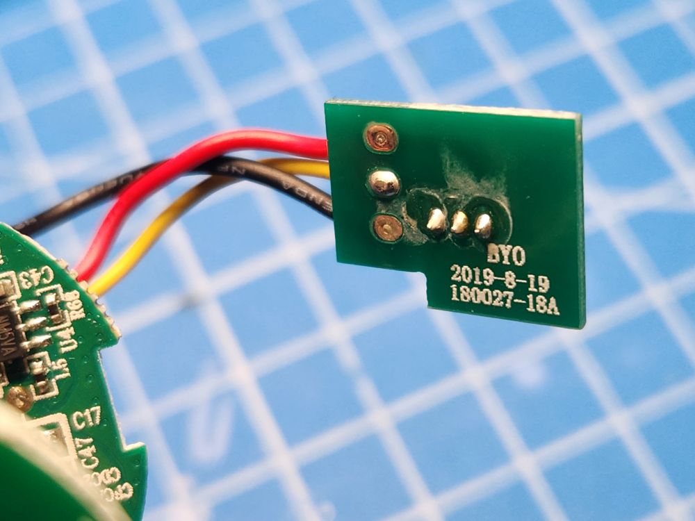 the back of a PCB with a 3-pin connector. three wires are connected to the PCB: red, yellow, and black.

red carries battery +, black is battery -, and yellow is for the data line which is used to communicate with the lightsaber blade.
