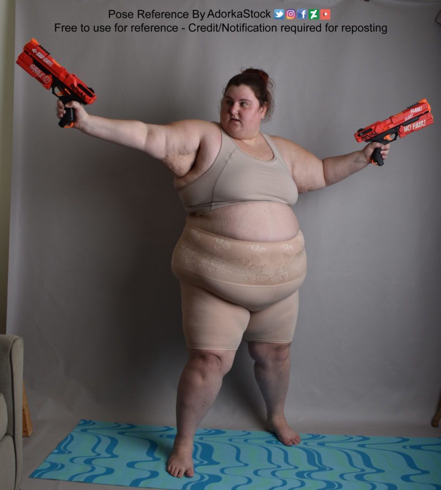 A fat white woman standing, dual wielding red nerf guns, pointing in opposite directions.