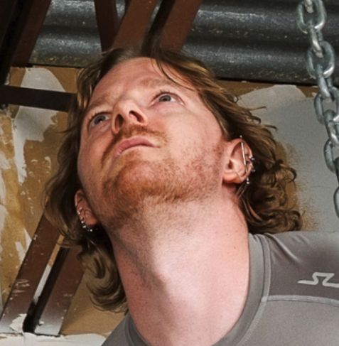 male face turned upward exposing the underside of the chin 