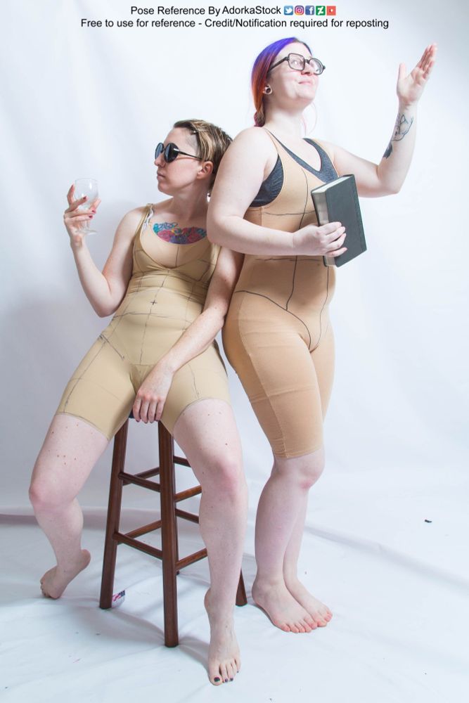 two thin, white, female pose reference models in sitting and standing poses, turning away from each other. The seated one is holding a wine glass. The standing one is holding a book with one arm raised as if about to give a speech or lecture or both honestly. 