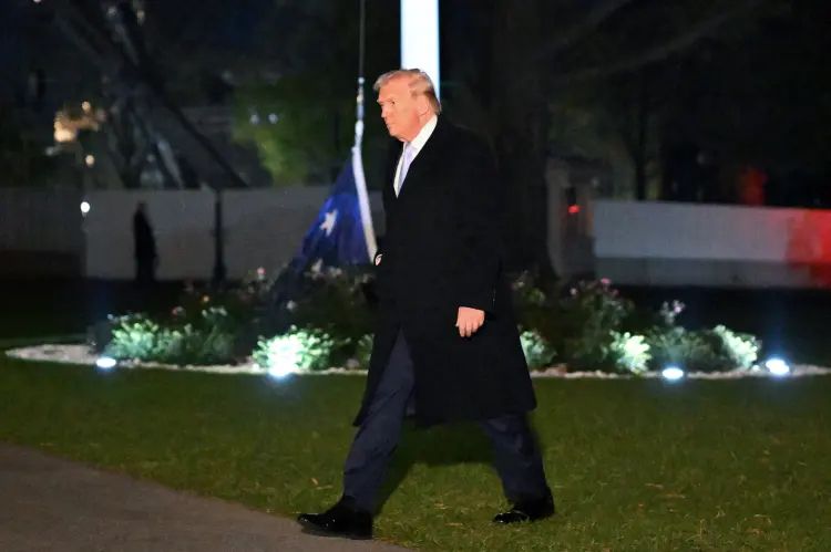 Trump walking on White House grounds where one of the huge ass American flags he installed is actually at the bottom of the flag pole on the ground. He doesn’t notice or care