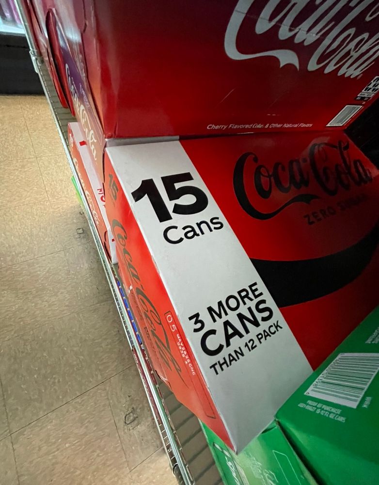 A 15 pack of Coke Zero that reads “15 cans.. 3 more cans than a 12 pack” 