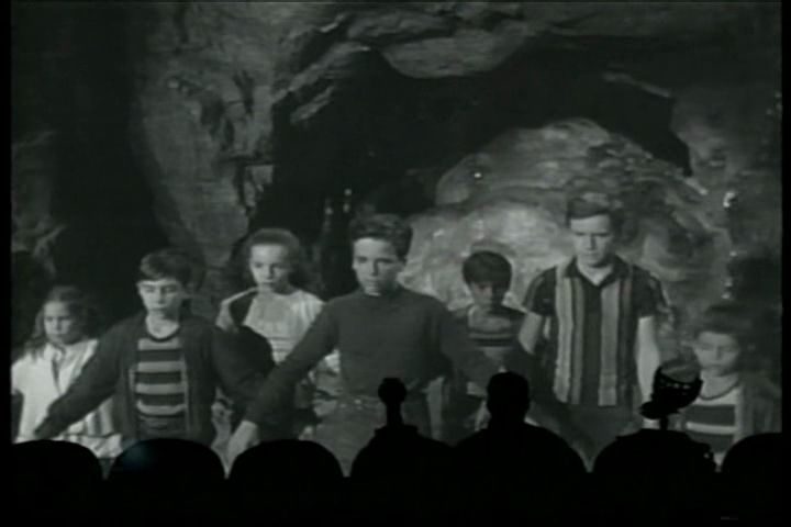 Screen shots from the MST3K episode on The Space Children. Here, Michel Ray (as Bud) and the other Space Children protect a giant space blob that is emerging from a cave.