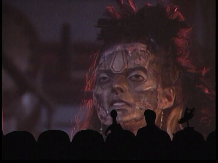 Screenshots from the MST3K episode of Robot Holocaust. Spoiler: Here we see that the Dark One's henchwoman, Valaria, has been a robot the whole time.
