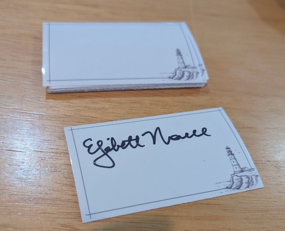 A book plate showing a line drawing of a lighthouse is signed by Elizabeth Norell.