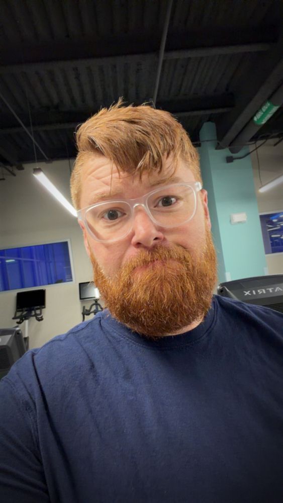 Ginger bearded guy in a blue shirt at the gym