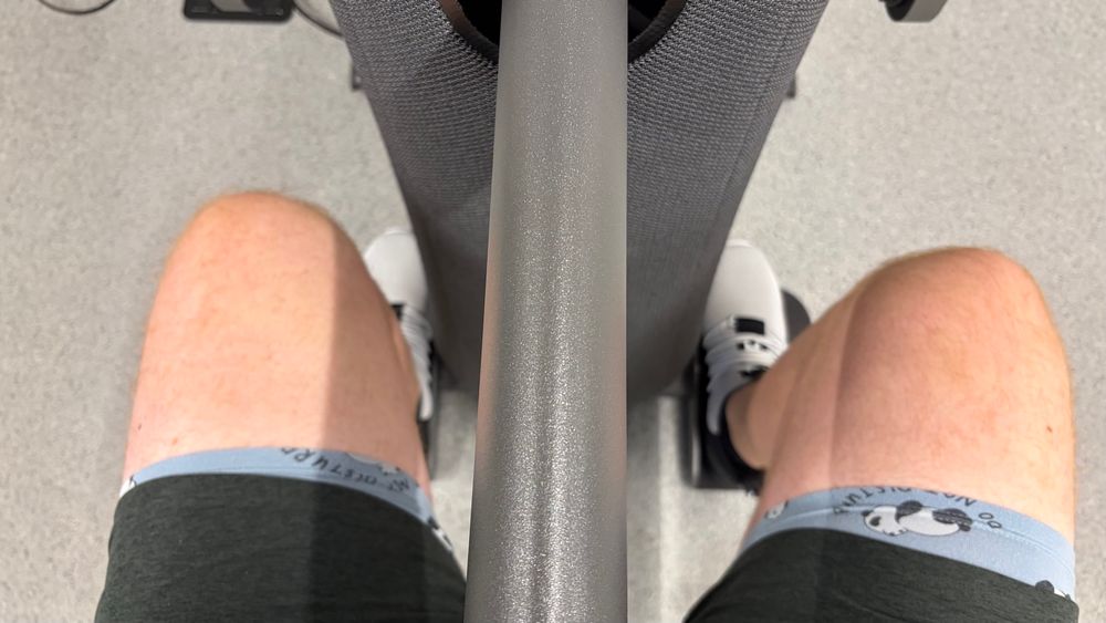 Green shorts with underwear expose on a fitness equipment