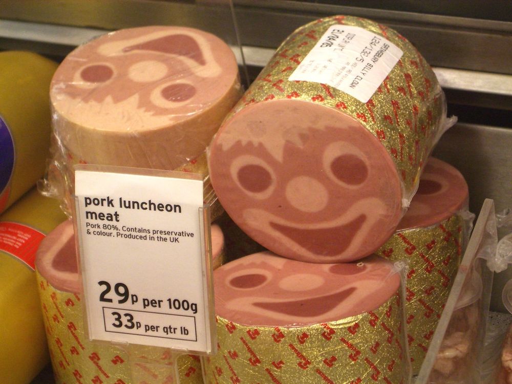 Rolls of pork meat that have a smiling clowns face embedded in them. 