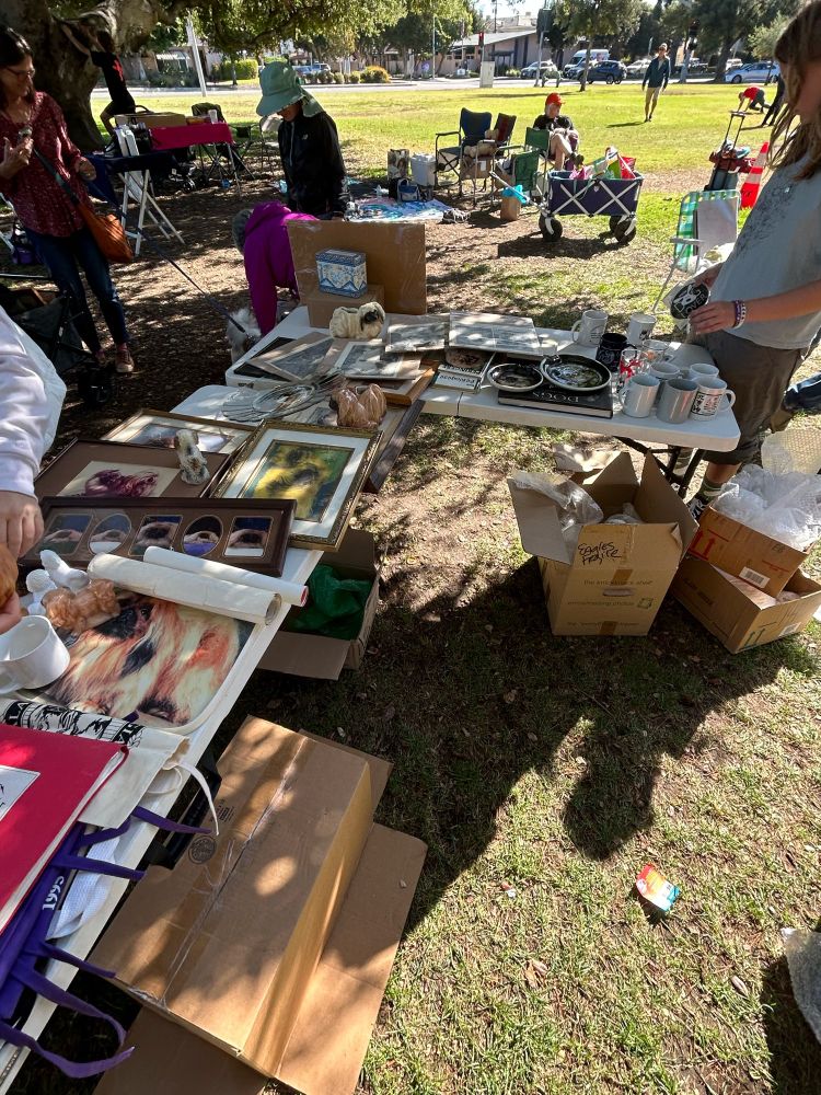 A large table of free Pekingese memorabilia