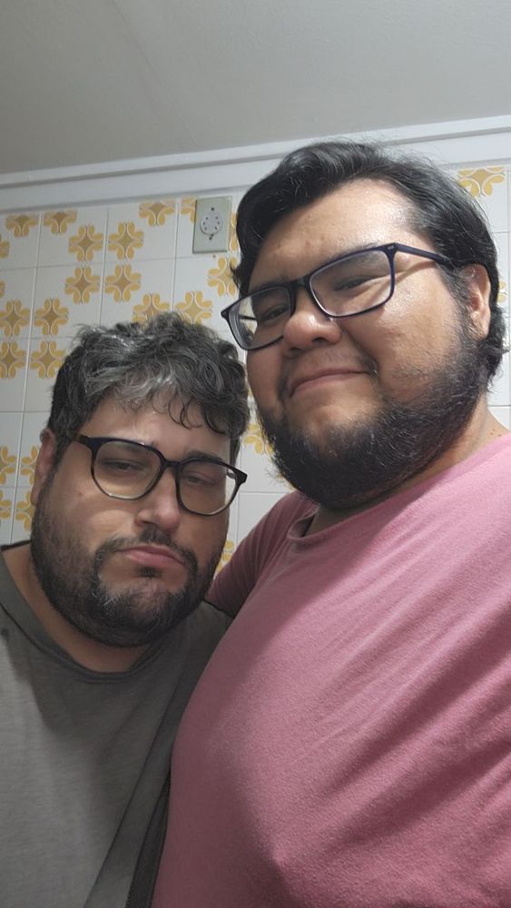 Picture of Nerdychubby and I. I'm smiling and hes making a grumpy face on purpose 