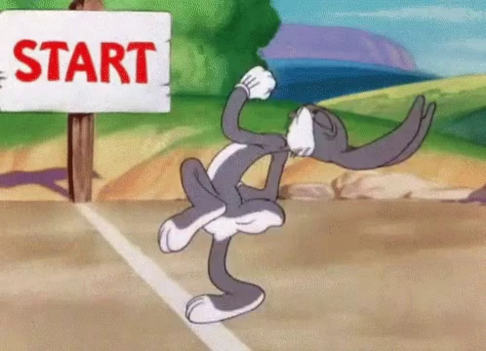 bugs bunny is jumping in front of a sign that says start .