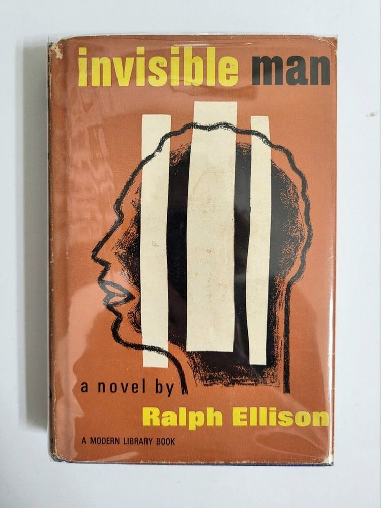 Picture of the 1952 hardcover edition of the book "Invisible Man" by Ralph Ellison, laying flat on a plain gray table.