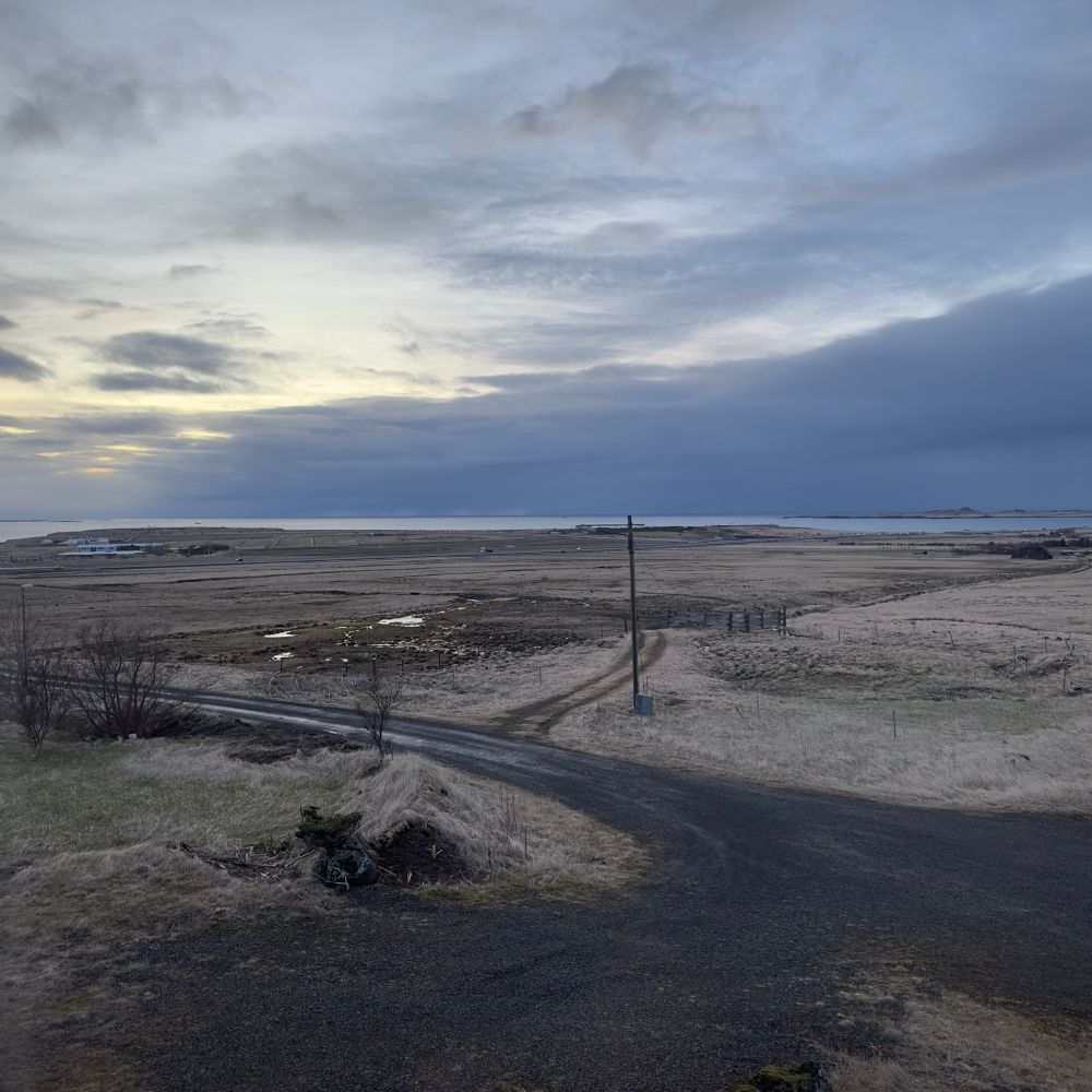 View of sea and field in Iceland at 18:35

