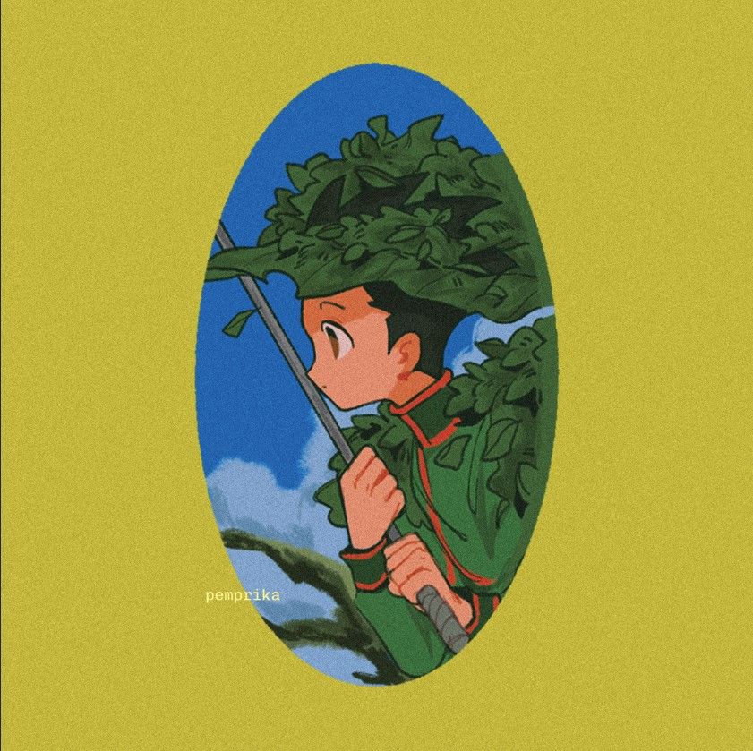 Side profile of Gon Freecs from Hunter x Hunter attentively looking left while gripping a fishing rod and covered with green leaves. Background shows a blue sky and a moss-like tree.