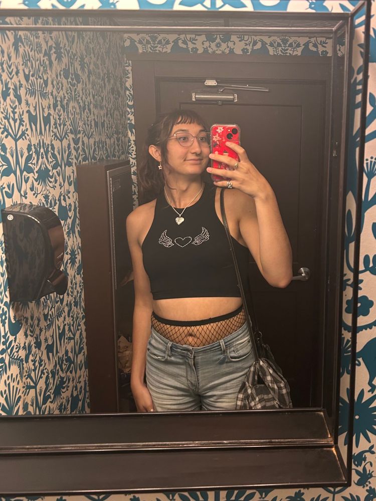 Maia smiling in the mirror