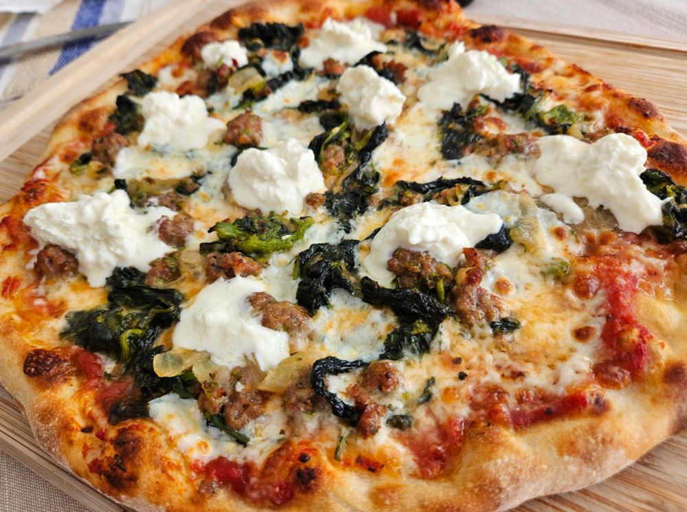 NY-style Pizza: Italian Sausage, Rapini, Ricotta, Fior di Latte, Pecorino, Onions, Garlic, Stracciatella