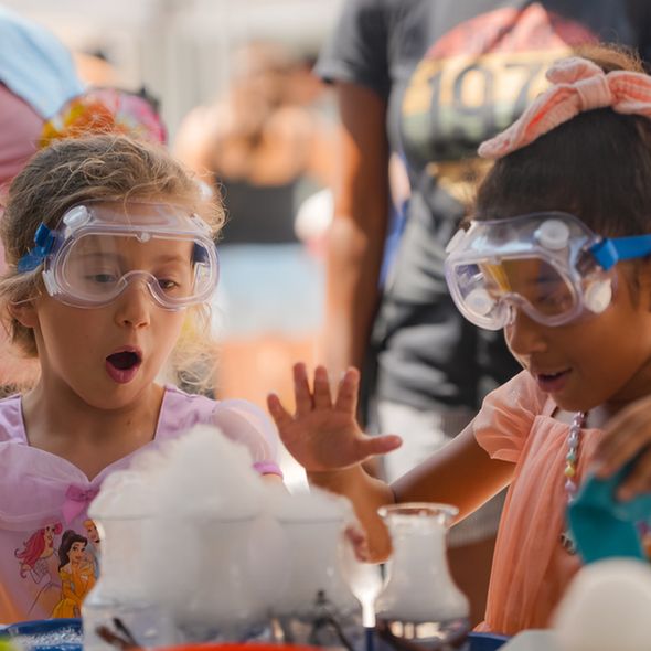 ACS Fall 2025 Washington, D.C. Kids Zone activities with spice cloud bubble with two children wearing goggles 