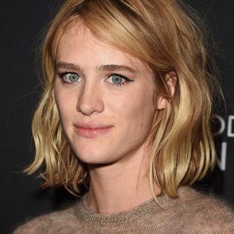 she has Grey eyes and blonde hair lookin kinda baffled

Mackenzie Rio Davis (born April 1, 1987) is a Canadian actress, producer, and model. She's known for her TV roles as Cameron Howe on AMC's Halt and Catch Fire, and Kristen Raymonde on the miniseries Station Eleven,