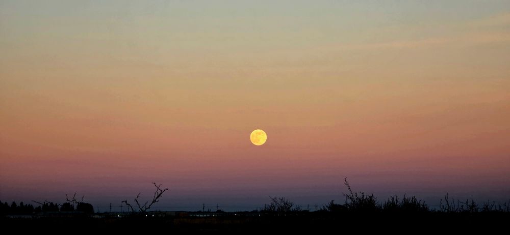 moonrise with sunset clouds