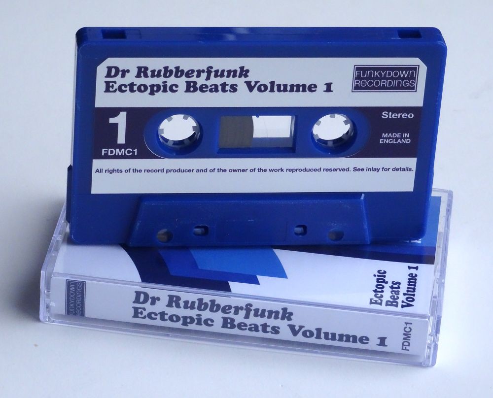 Cassette tape edition of ‘Ectopic Beats’ by Dr Rubberfunk sitting on top of the cassette case. The tape is dark blue and features a white label with dark blue text. #BandcampFriday #BeatTape #MixTape #InstrumentalHipHop #CassetteCulture #VinylVulture