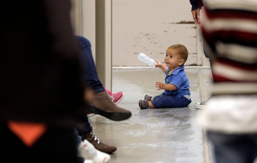 Image of a toddler in a CPB detention facility. Photo by Eric Gay-Pool/Getty Images