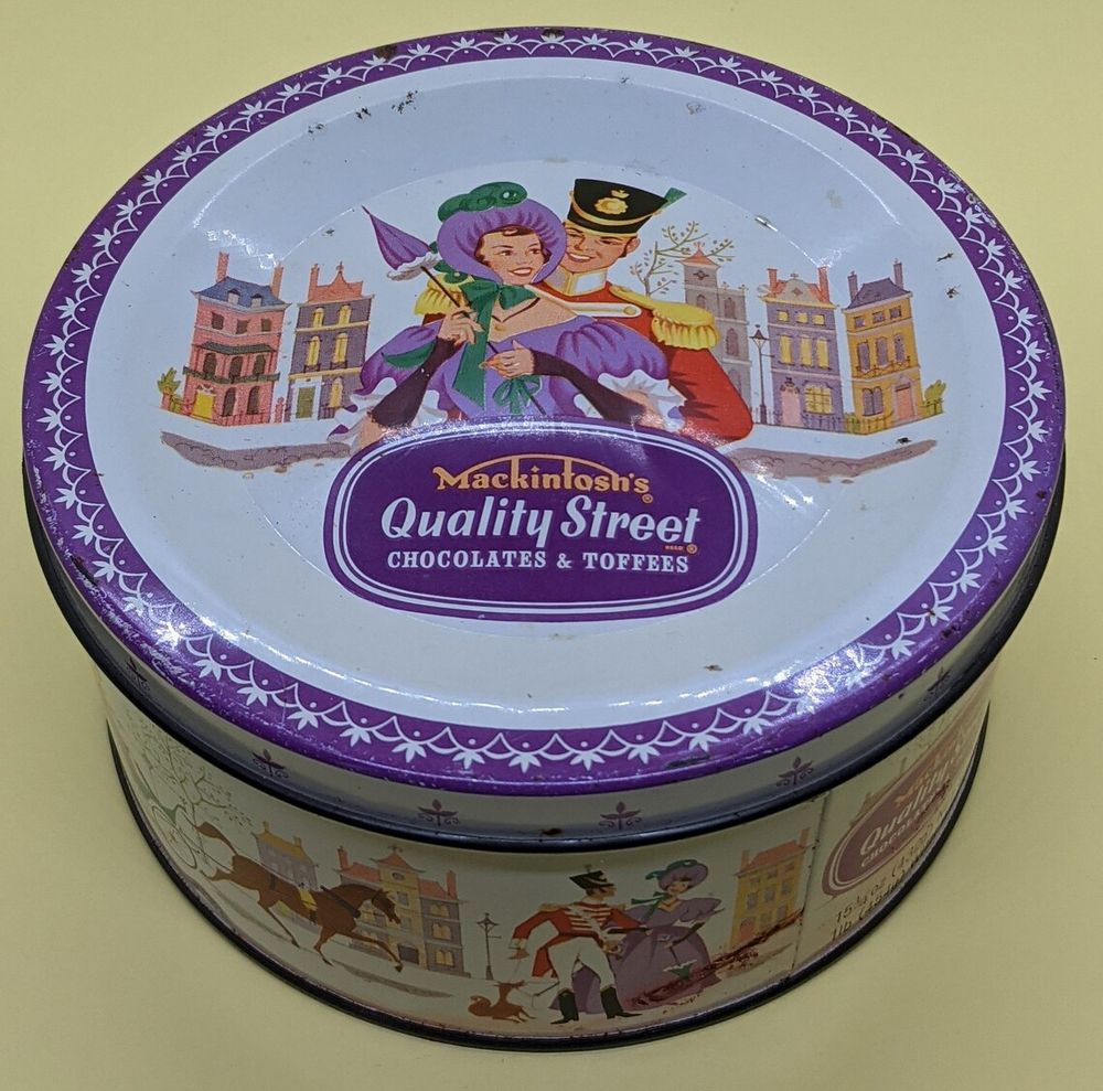 Image of a vintage Quality Street chocolate metal tin. These are usually used for keeping sewing supplies (and other things).