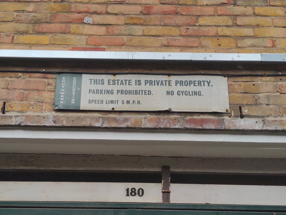 Green and whole enamel sign:
THIS ESTATE IS PRIVATE PROPERTY.
PARKING PROHIBITED. NO CYCLING.
SPEED LIMIT 5 M.P.H.
Vertical branding on left: SOUTHWARK CORPORATION 