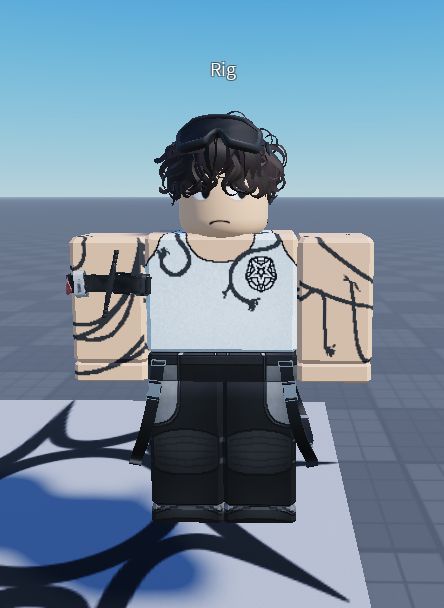 a roblox screenshot of a rig of winry stood on a spawn point. he has pixel art cables around his arms and circled around the urbanshade logo on his vest