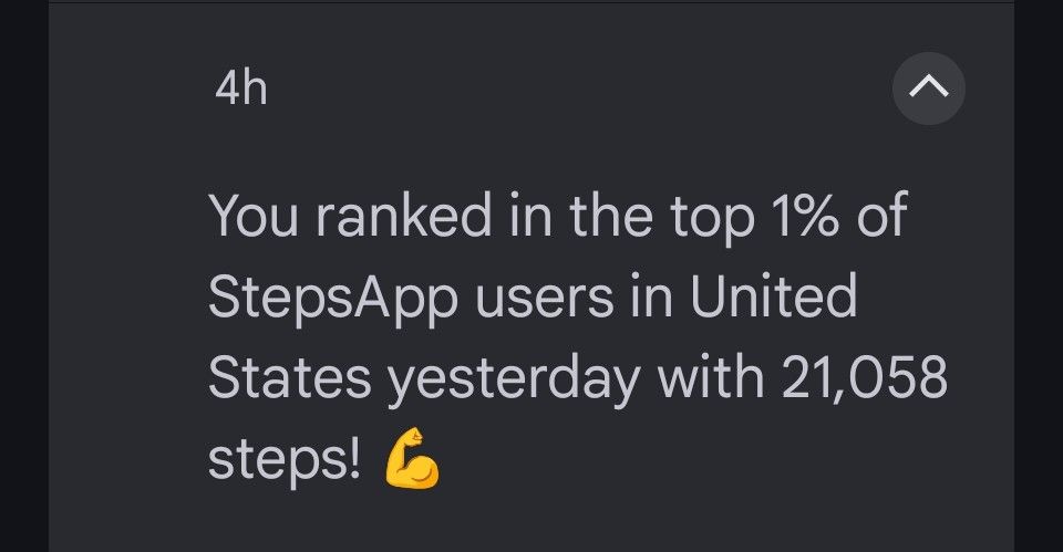 notification that says "You ranked in the top 1% of StepsApp users in United States yesterday with 21,058 steps! 💪"