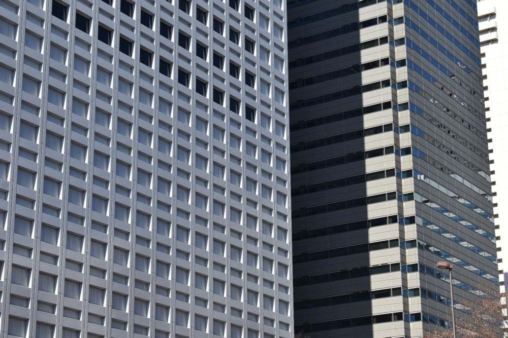 Close up of the exteriors of two skyscrapers in Shinjuku, Tokyo 