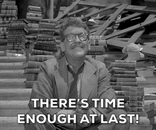 Screenshot from the Twilight Zone. A man in glasses sits beside a stack of books, with the caption 'There's time enough at last!' 