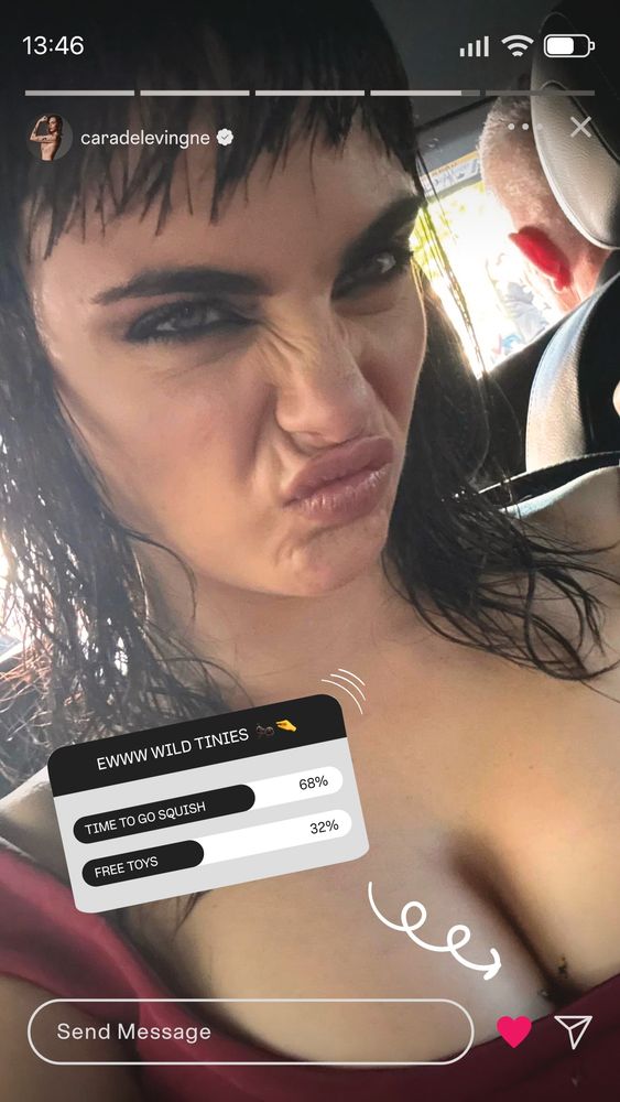 Instagram Story from Cara Delevingne, featuring a selfie of her in a red dress, pouting at the camera. In her cleavage a micro shrunken woman and a micro shrunken man try not to fall in the darkness between her breasts. An unlucky micro shrunken man falls on the wrong side of the dress towards its doom. The IG Story features a poll saying: "EWWW WILD TINIES". OPTION 1: "TIME TO GO SQUISH - 68%". OPTION 2: "FREE TOYS - 32%".