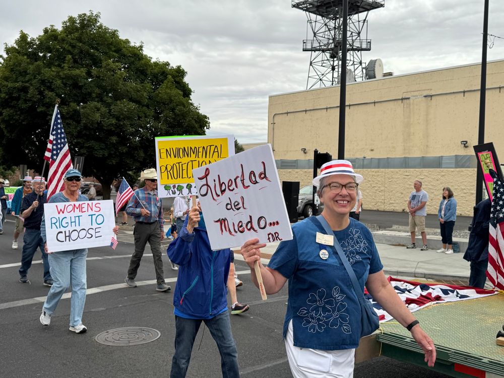 Marchers from Umatilla County Democrats at the parade carrying signs flags