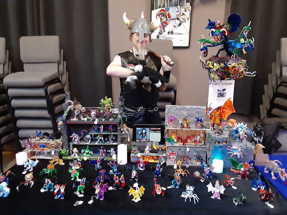 Me at the Teaching Arts Rochester Knight to Remember Renaissance Festival Fundraiser. I'm selling my pipe cleaner monsters and dressed as the Norse God Tyr with a Viking helmet and a Fenris Wolf puppet on my hand.