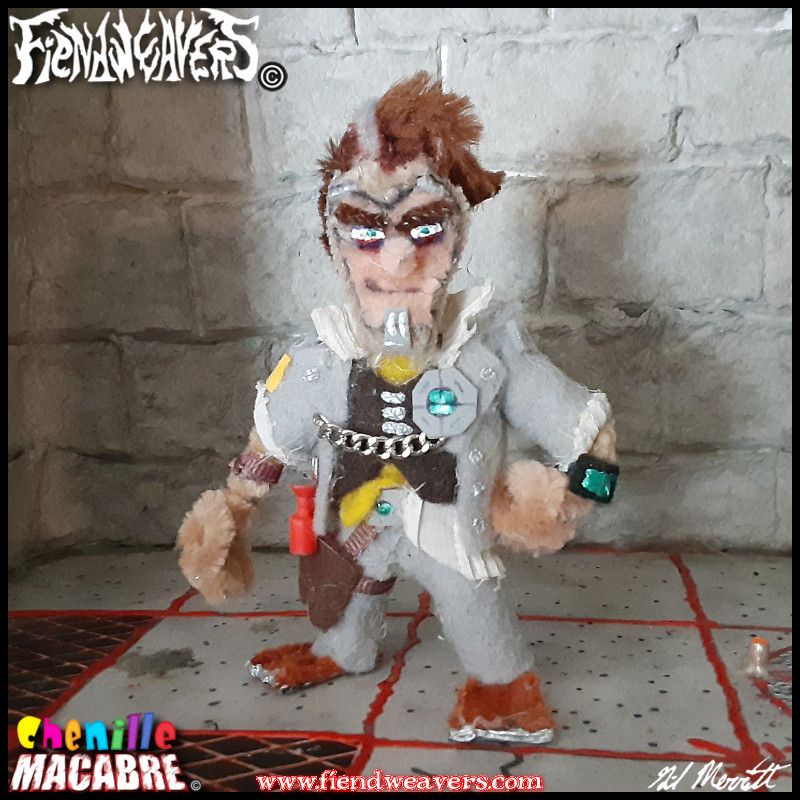 A pipe cleaner figure I built of Handsome Jack from BORDERLANDS 2. Jack has a pipe cleaner frame, with a gray felt suit and flowing brown hair with a grey streak. He smugly smiles at the camera, and stands 3" (7.62 cm) high.