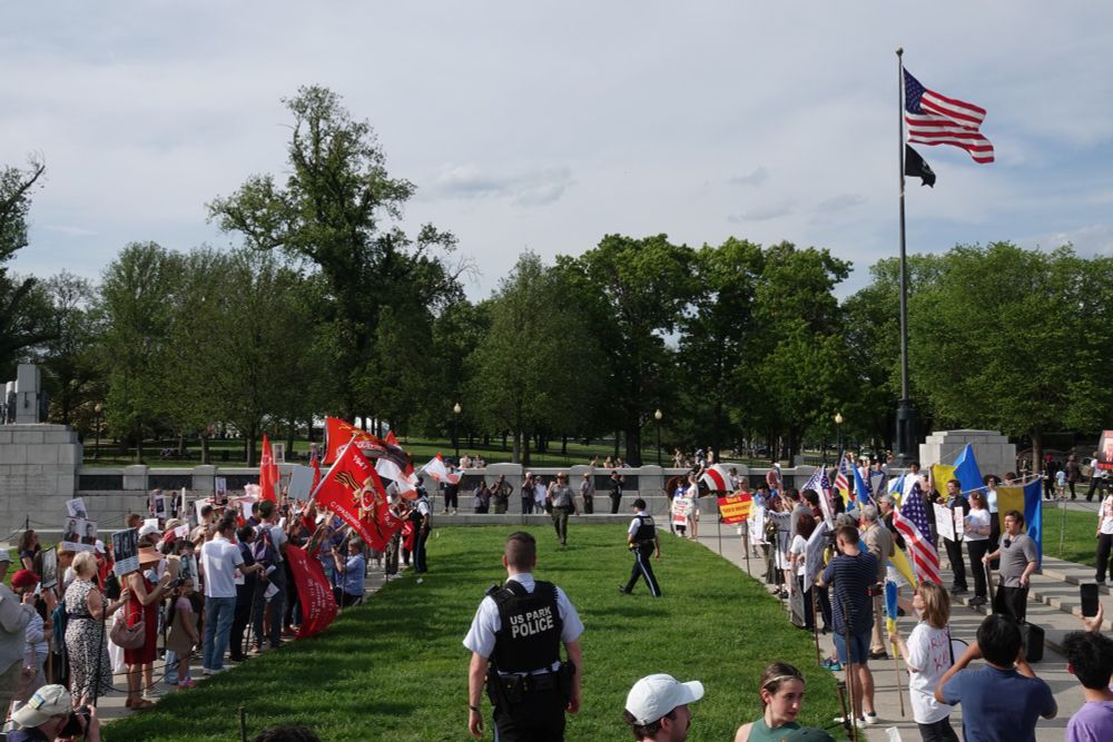 Police patrol the gap between the two protests