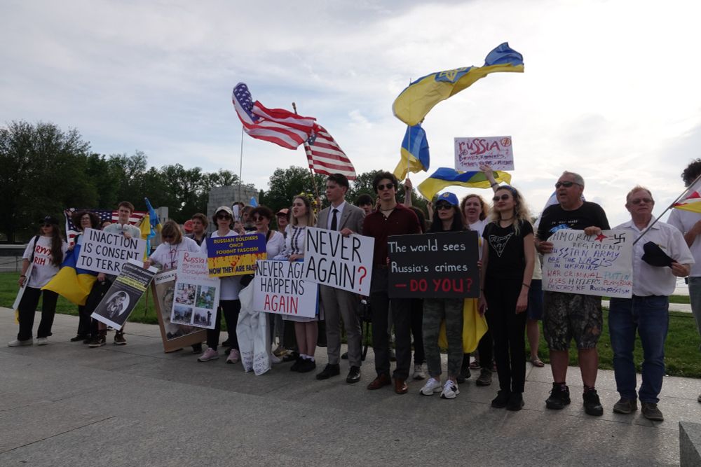 Ukranian group poses victoriously after a long afternoon of disruption