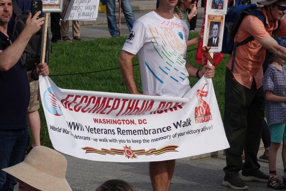 Banner held by the Russian rally: WWII Veterans Remembrance Walk