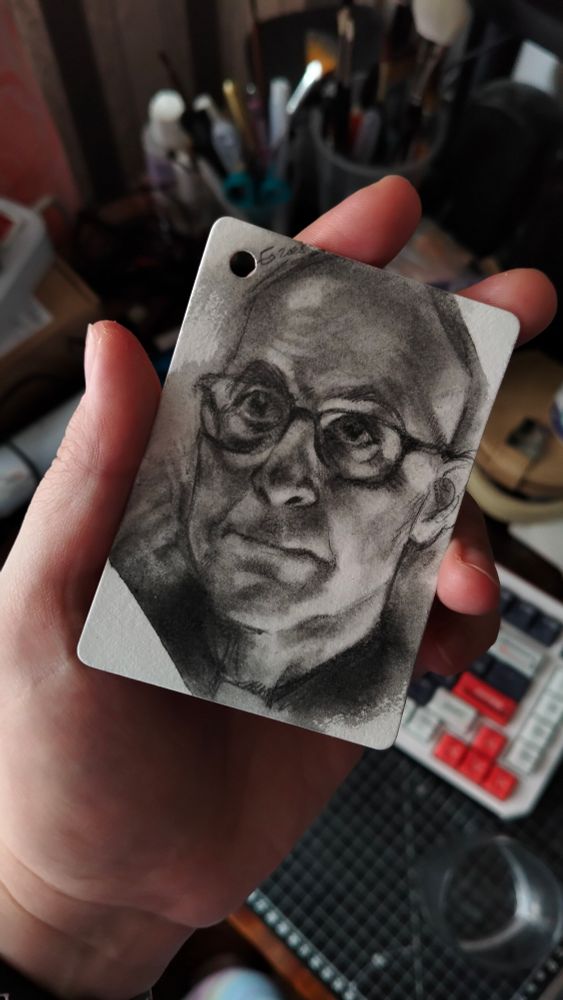 a photo of a tiny graphite sketch of cardinal Aldo Bellini as portrayed by Stanley Tucci 