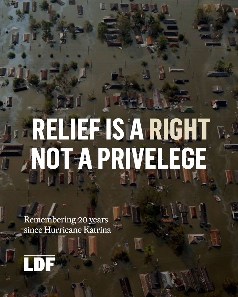 Aerial view of a flooded neighborhood with the text 