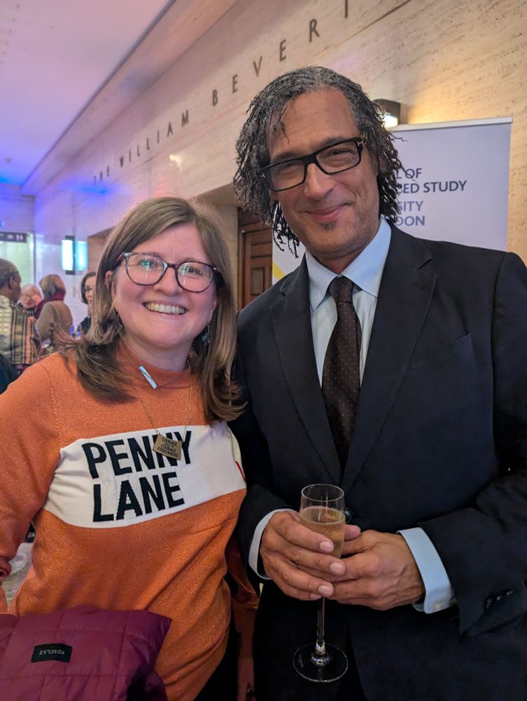 A very happy archivist standing with Professor David Olusoga. 