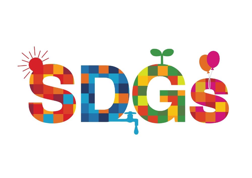Colorful logo of the United Nations Sustainable Development Goals, abbreviated as "SDGs," decorated with symbolic icons like a sun, plant, water tap, and balloons.