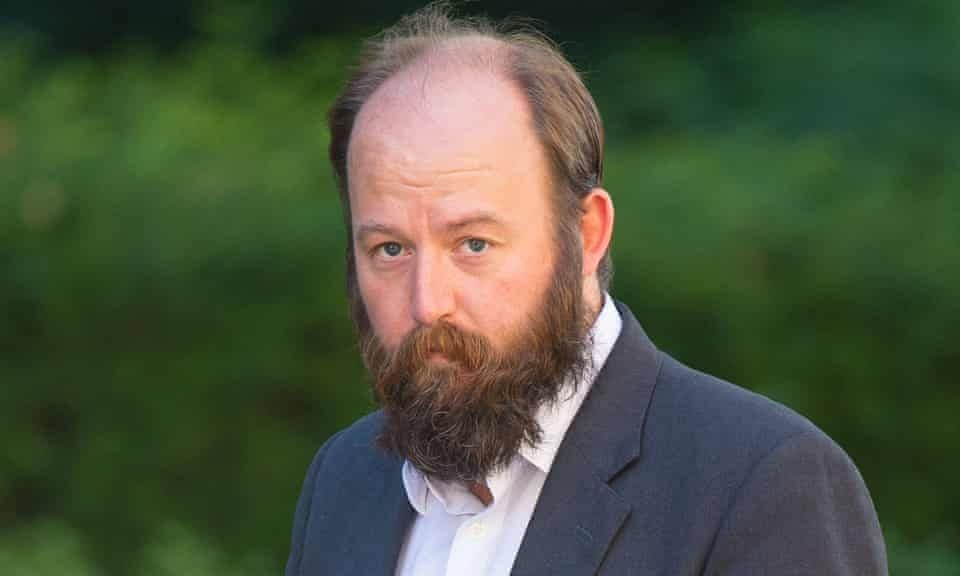 Nick Timothy in 2019. A balding man with brown hair at either side of his head and a shabby beard that makes him look like a minor early 20th Century royal who's been kept in a cellar for a month or two.