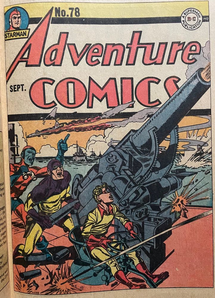 Sandman and Sandy operate an anti-aircraft gun while Manhunter acts as their spotter. 