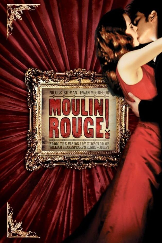 "Moulin Rouge" movie poster. A kissing male and female couple stand to the right of the poster with a gilded gold frame behind them with movie title and info inside. A red curtain is the backdrop.