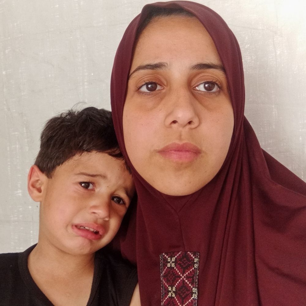 Soad and little Omar, crying