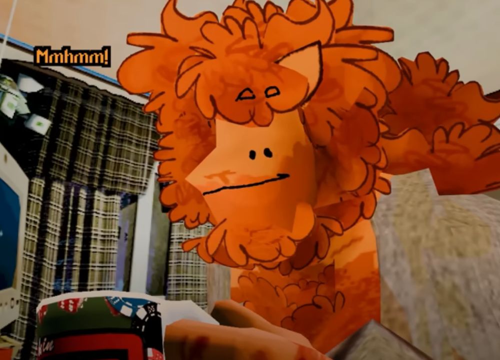 Ted groghl smiling towards the camera, holing a mug and wearing an open hoodie, as seen in the Harbor City WV Episode Ted and Toby's Heater is Broken