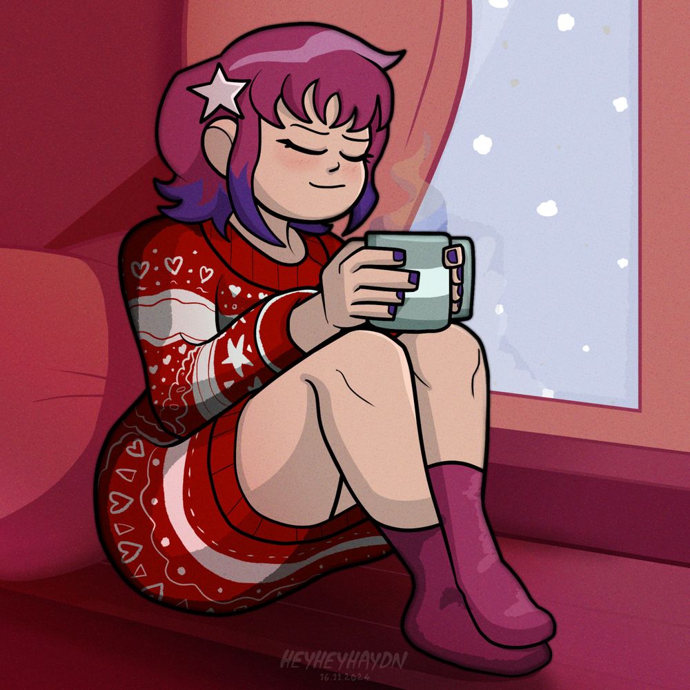 Ramona Flowers sits in a large Christmas jumper with a mug of tea near a window. She is leaning against the curtain and looks cozy and peaceful as it snows outside